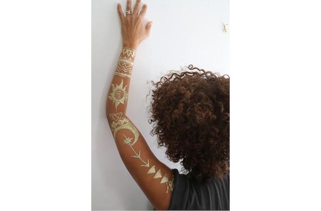 Woman with henna tattoo on arm