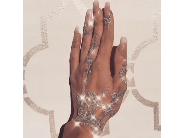 Glittery hand tattoo
